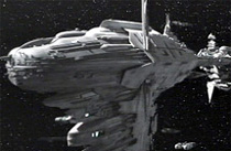 [Collapsed freeway bridge, flying]
